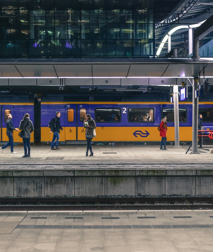 People Standing Near Train Under Shed 691471